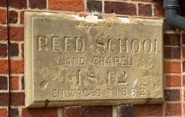 Old Reed School sign on side of former chapel