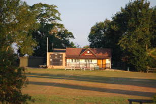 Looking across Reed Green to cricket pavilion